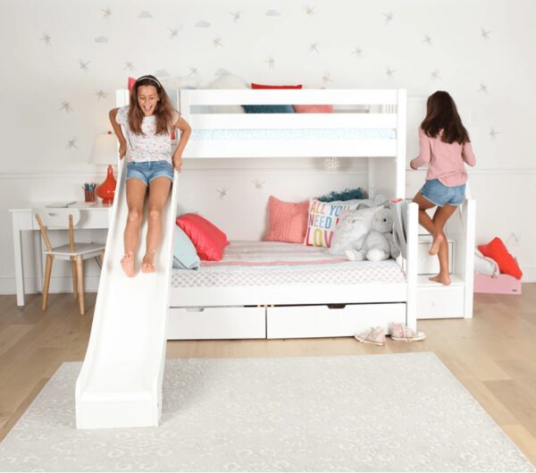Two girls playing on a bunk bed with slide